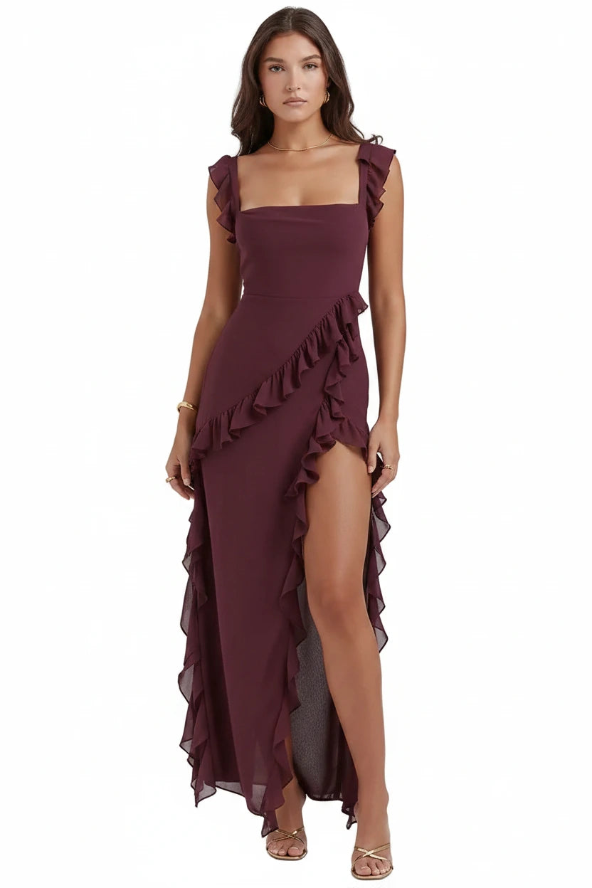 A woman wearing a classic sleeveless long maroon cocktail dress with a waist high slit-TTP