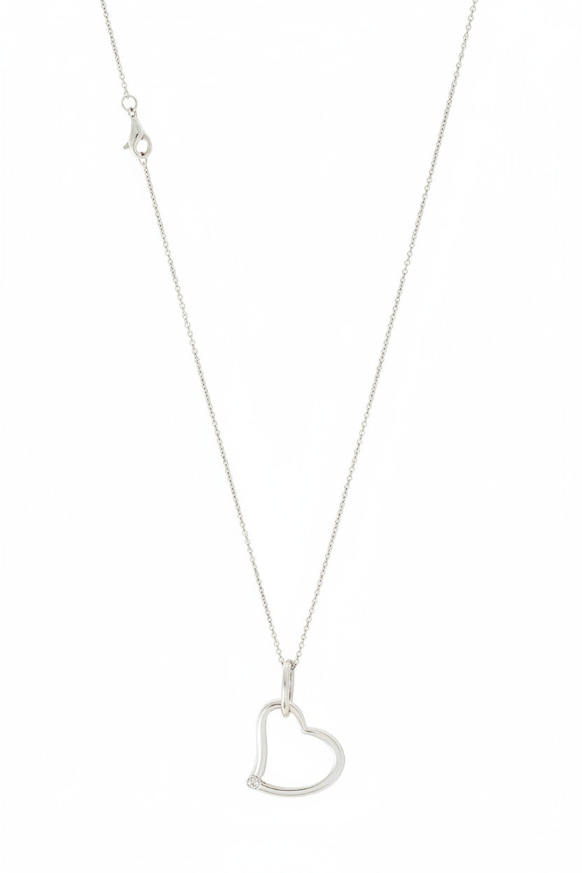 A sterling silver heart pendant necklace with a red heart-shaped detail in the center, displayed on a silver chain against a white background.