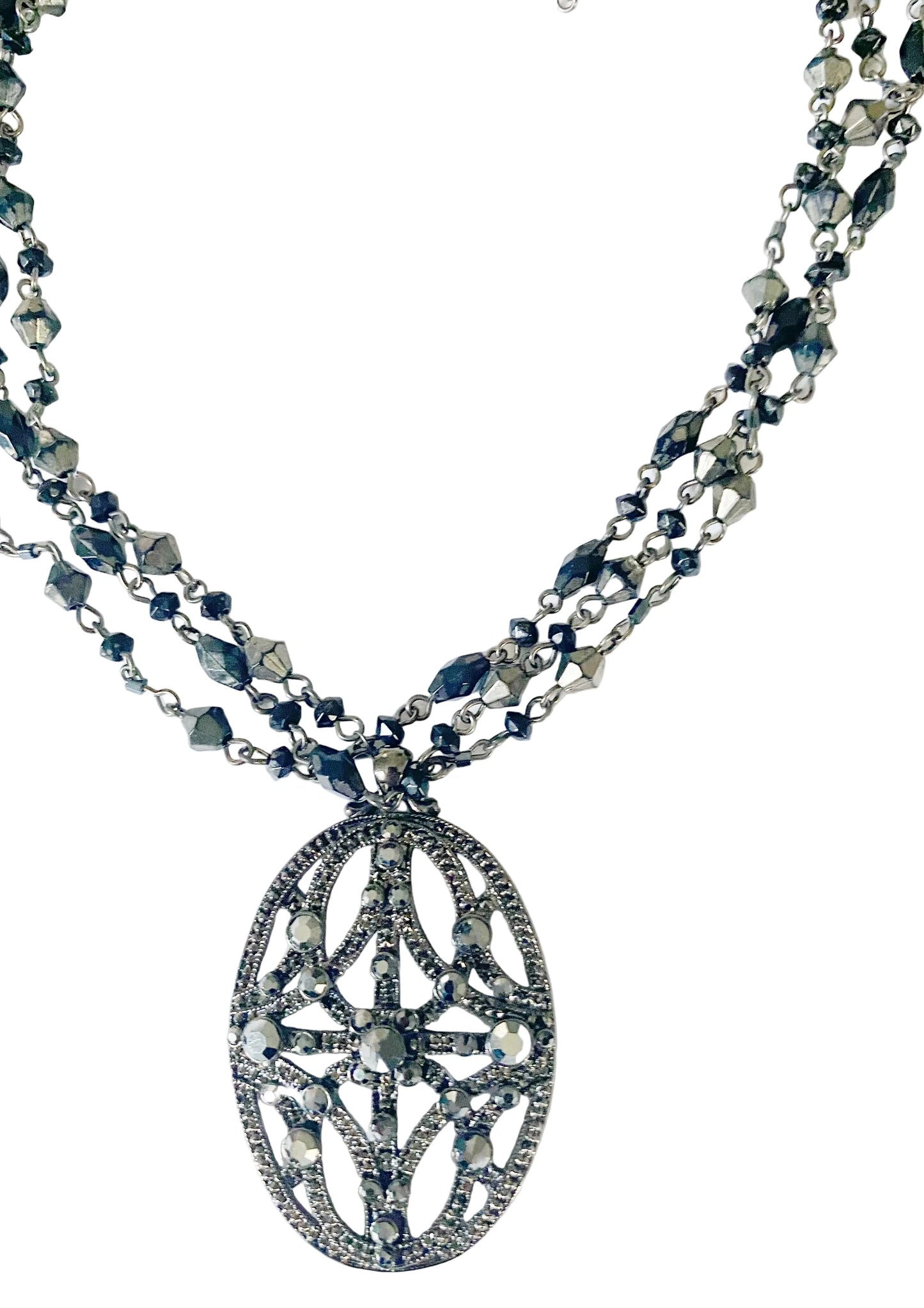 A black beaded necklace with a combination of square and round bead shapes, displayed against a white background.