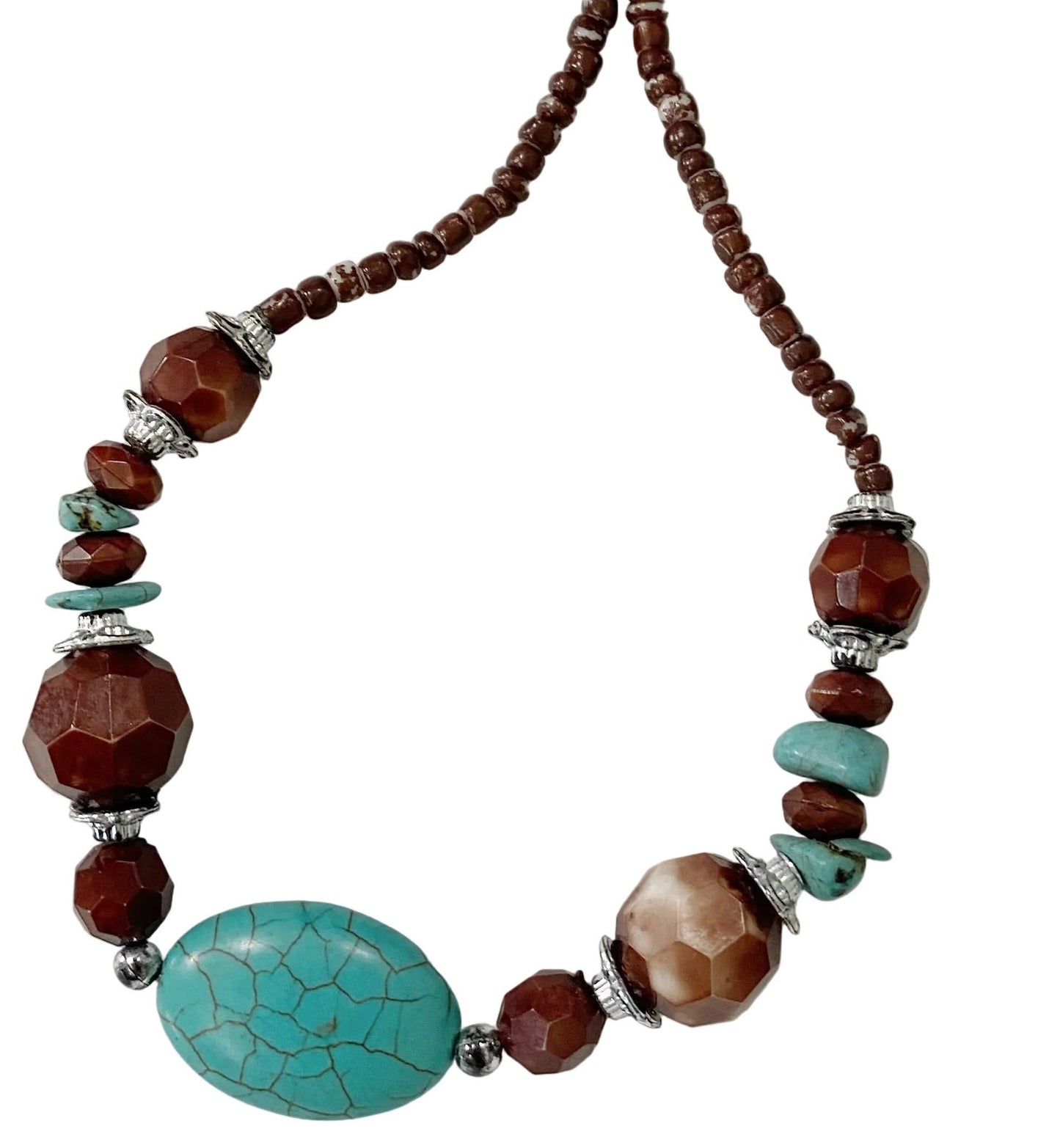 Necklace with brown and turquoise beads on a white background