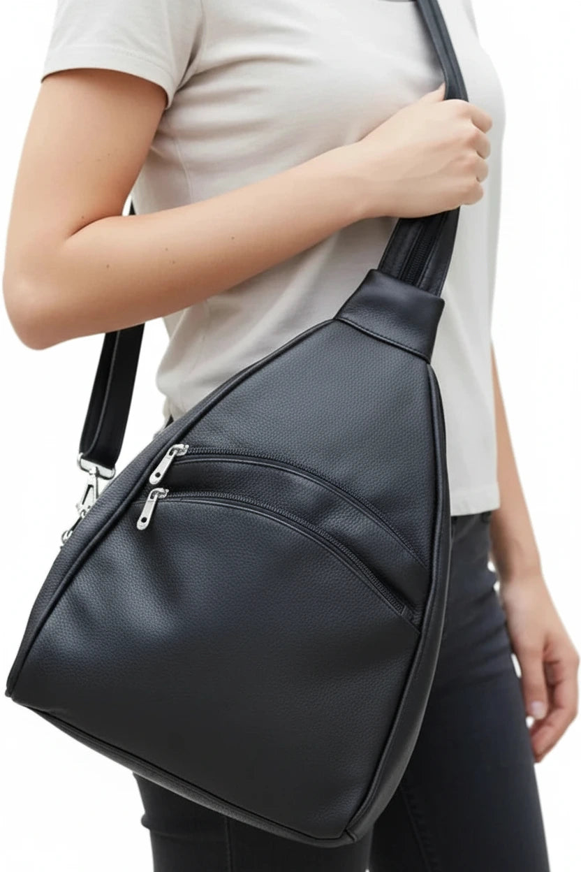 Black sling bag on a white background
