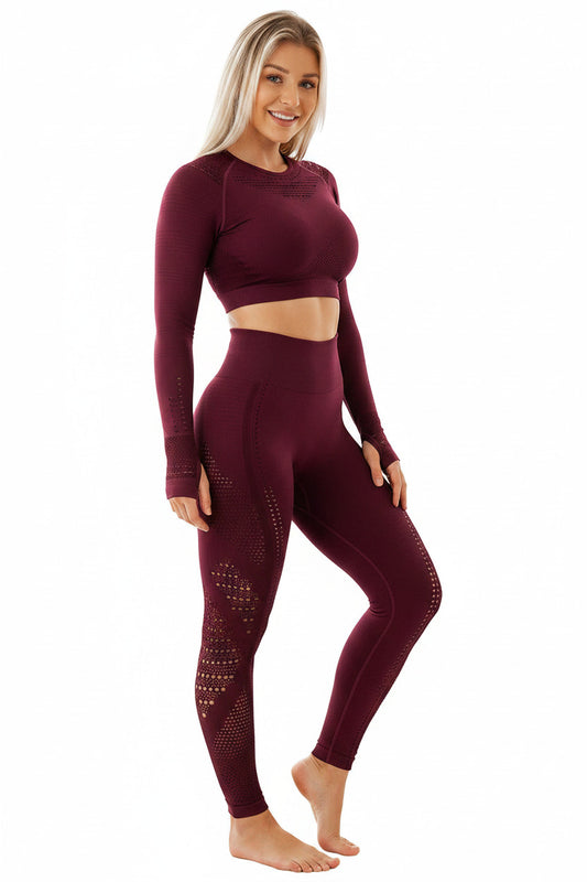 A model wearing seamless yoga gym suit in purple color. The suit consists of long-sleeve crop top and matching leggings.