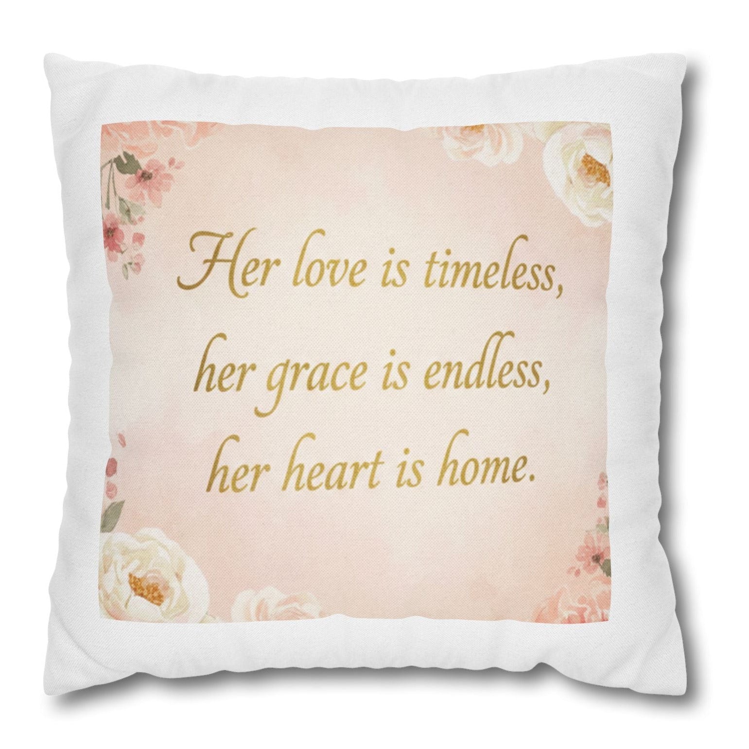 Decorative pillow with floral design and text on a white background