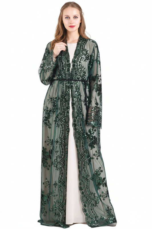 Woman wearing a green floral abaya with a white hijab on a white background