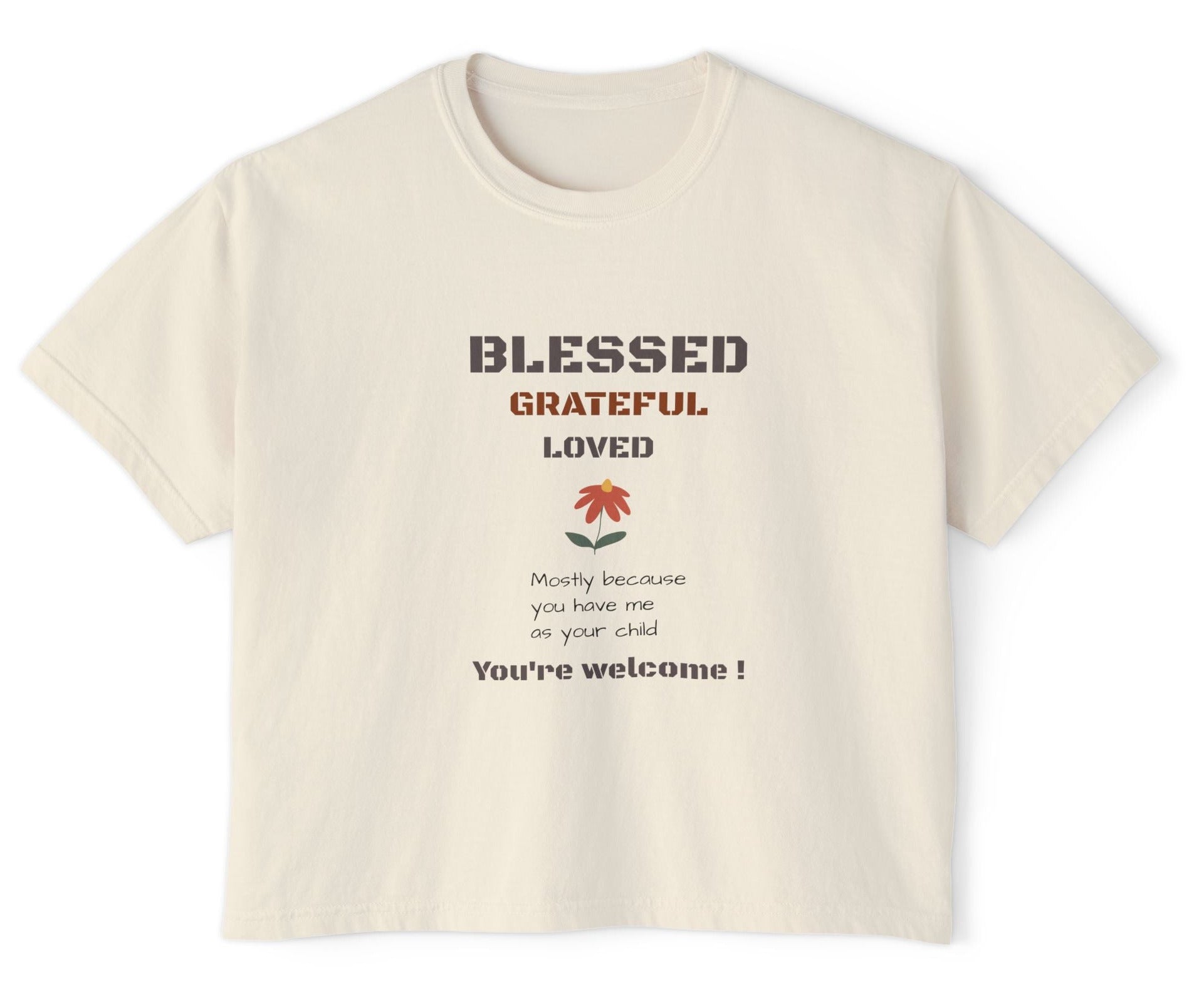 Beige t-shirt with motivational text and a flower graphic on a white background