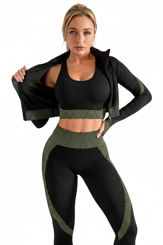 Woman wearing a black and green athletic outfit against a white background