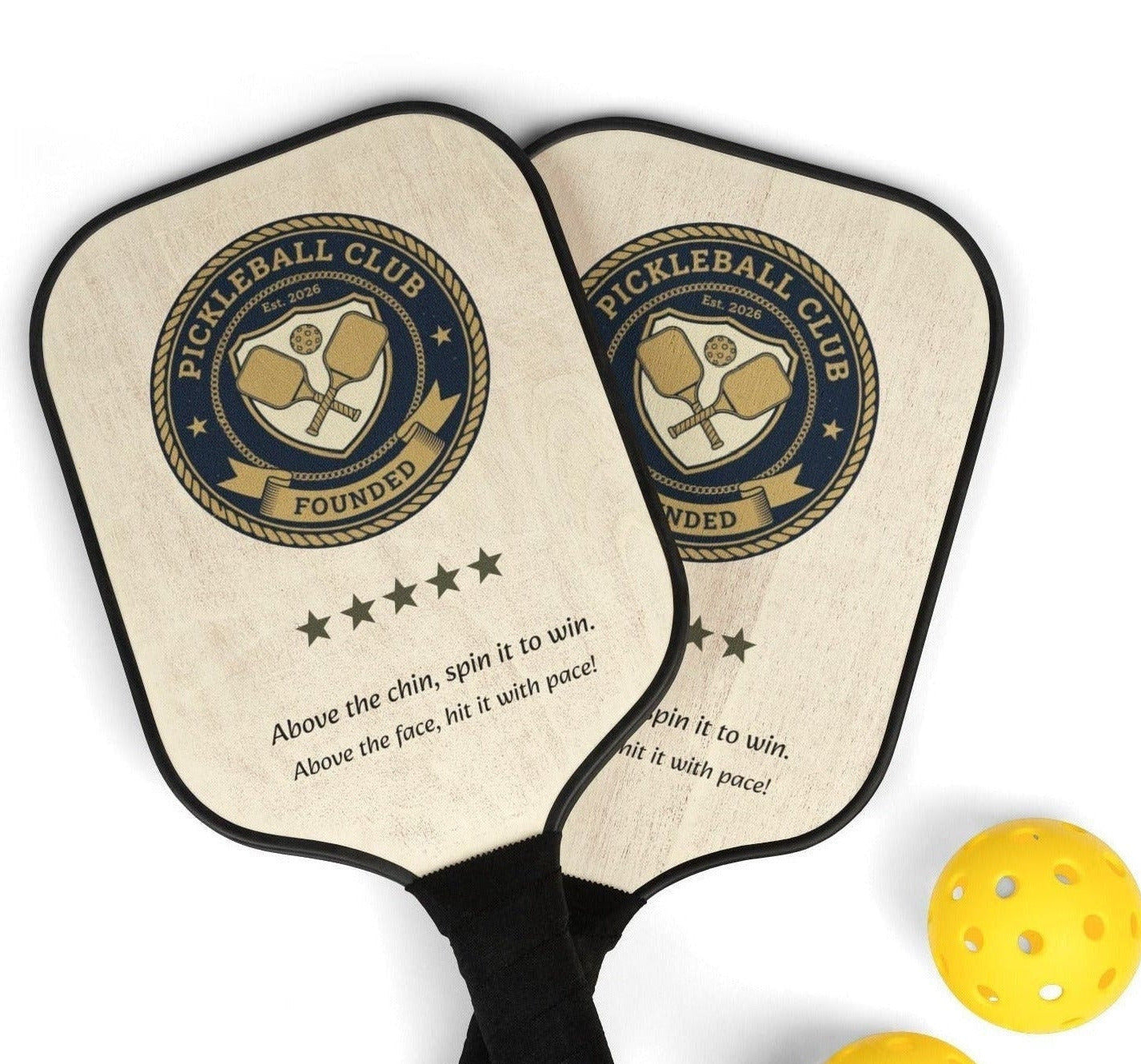 Two pickleball paddles with a design and text, accompanied by three yellow pickleballs on a white background.