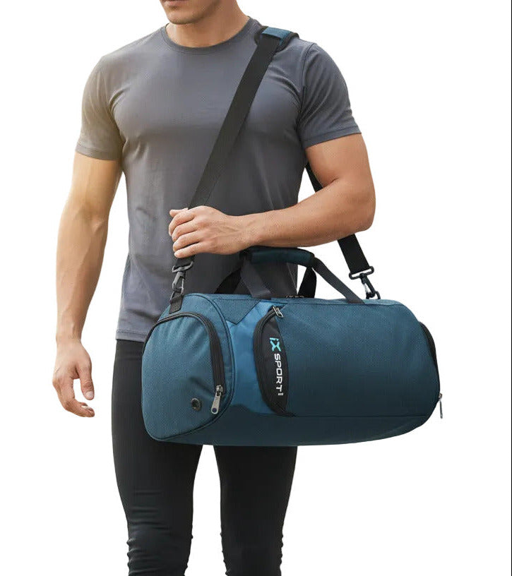 A dark teal and blue duffel bag with black handles and straps, featuring a vertical zippered pocket on the front with a 'SPORT' logo, shown on a white background.