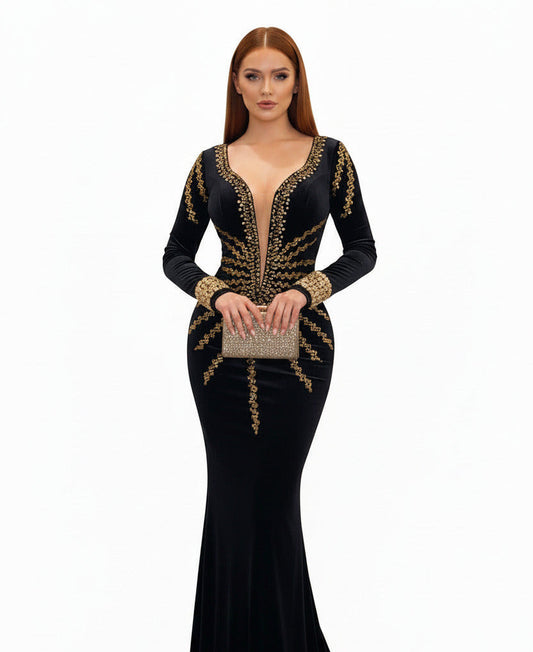 Black evening gown with gold embroidery on a white background