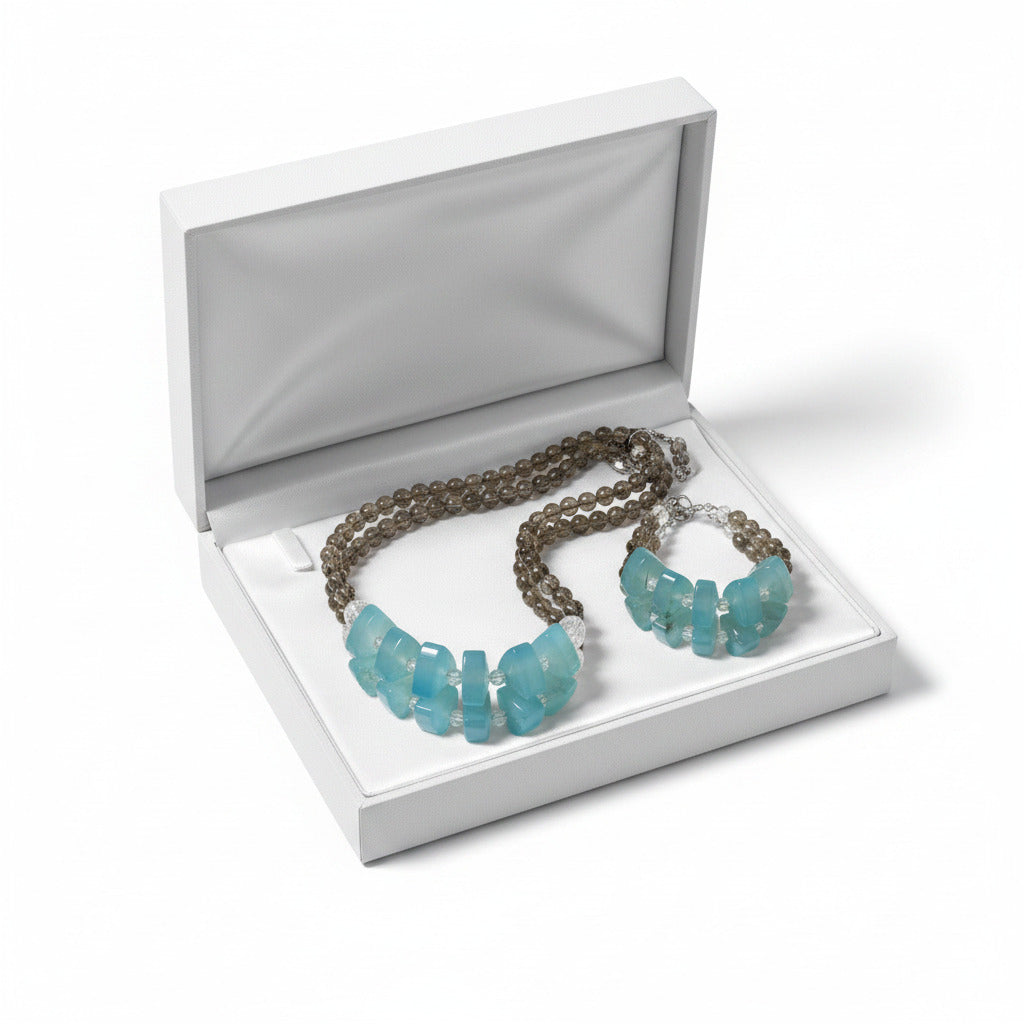 An Aqua Chalcedony Gemstone Set inside a white box - TTP