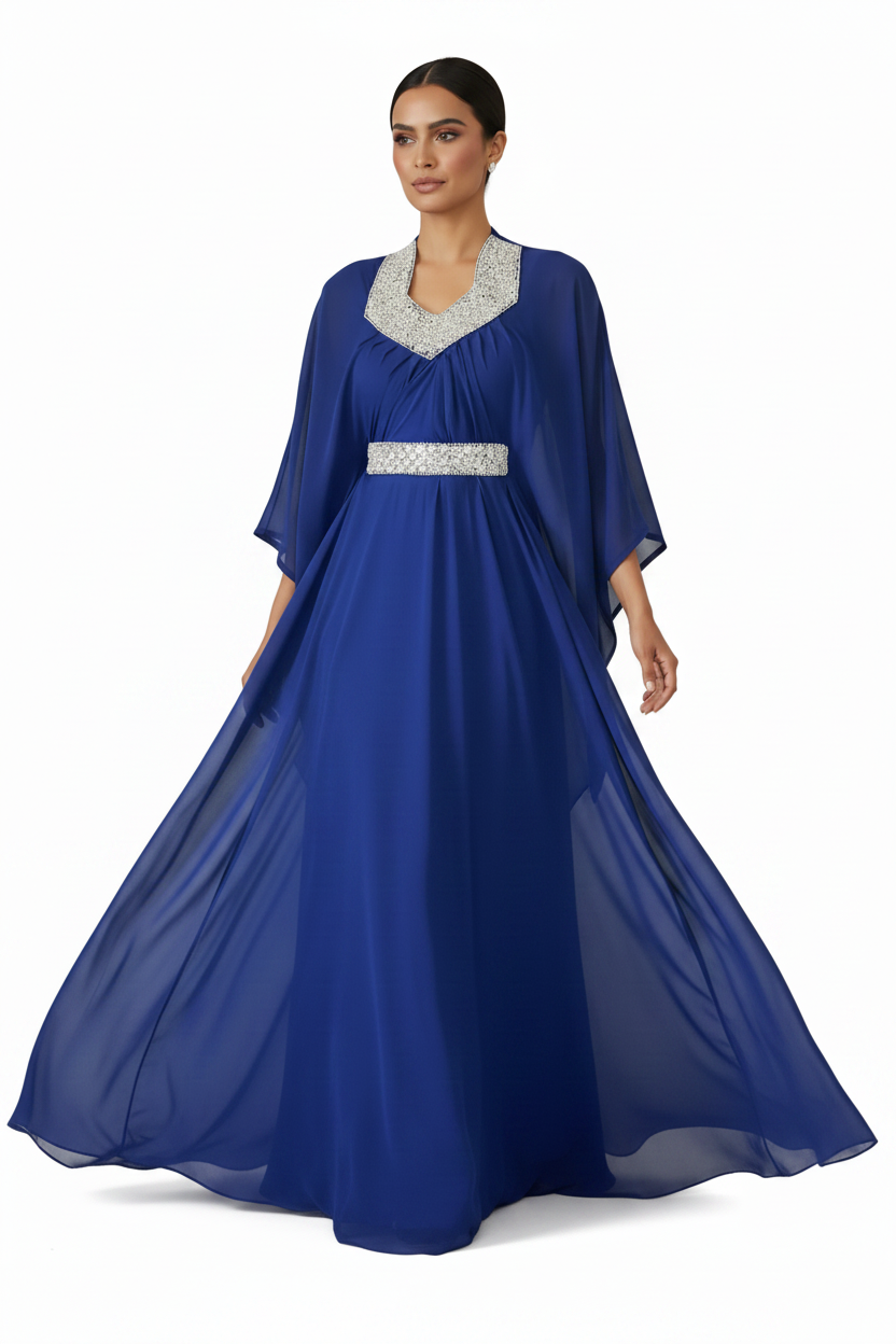 Woman wearing a blue Farasha gown with silver embellishments on a white background.