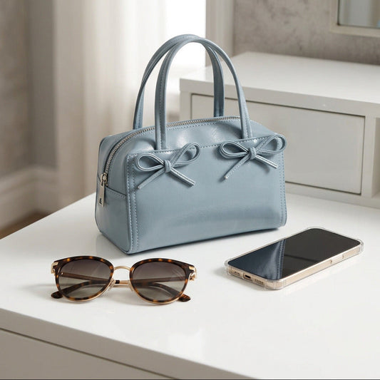  Kimshi blue bag on the top of a white dresser.