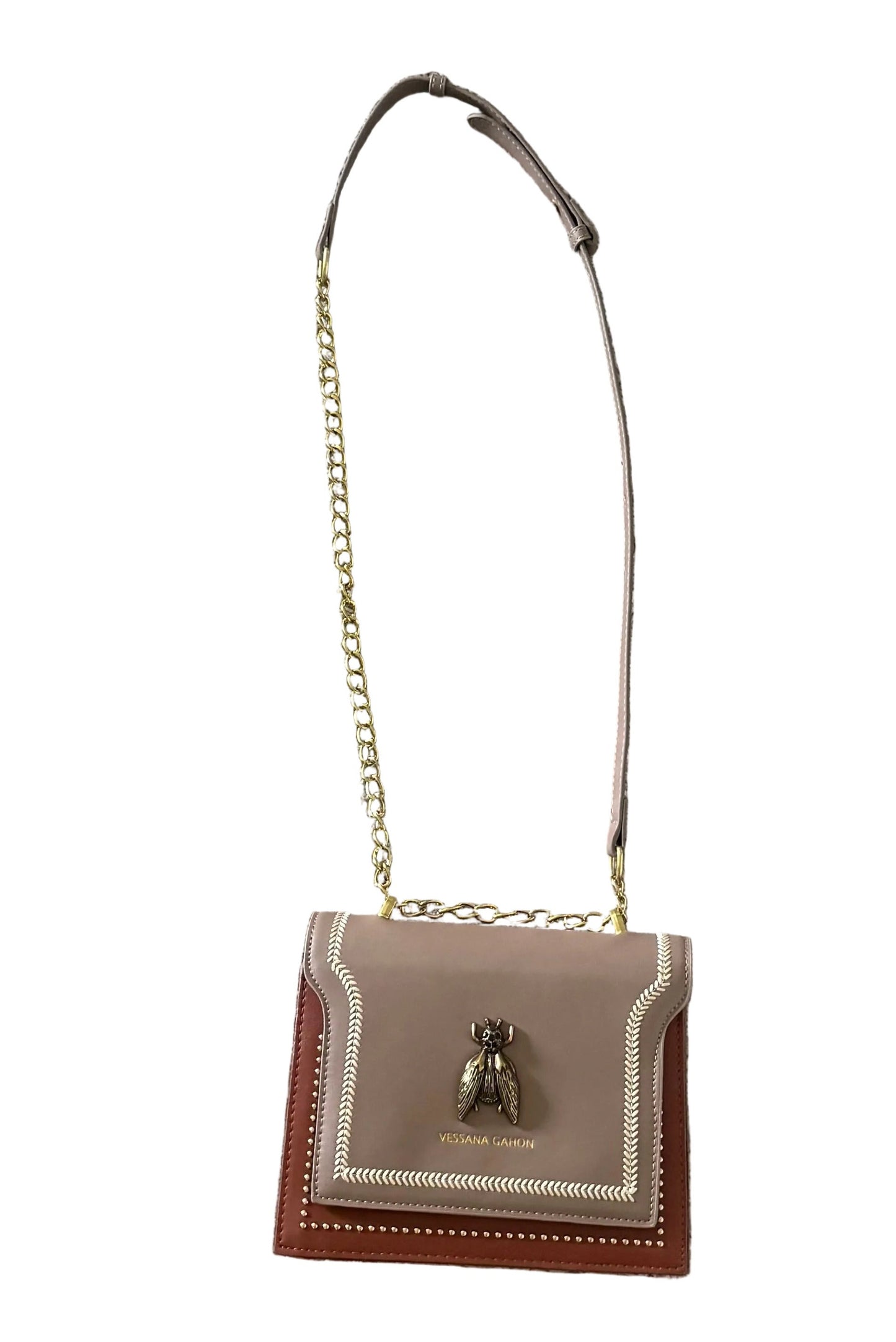 A small Vessana Gahon shoulder bag in taupe and brown leather with gold-tone chain strap and a bee hardware accent on the front flap, shown against a plain white background.