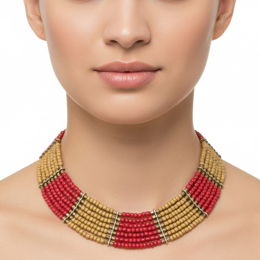 A multi-strand beaded necklace featuring alternating sections of natural tan wood beads and bright red beads, separated by small metallic spacer rings, shown against a plain white background.