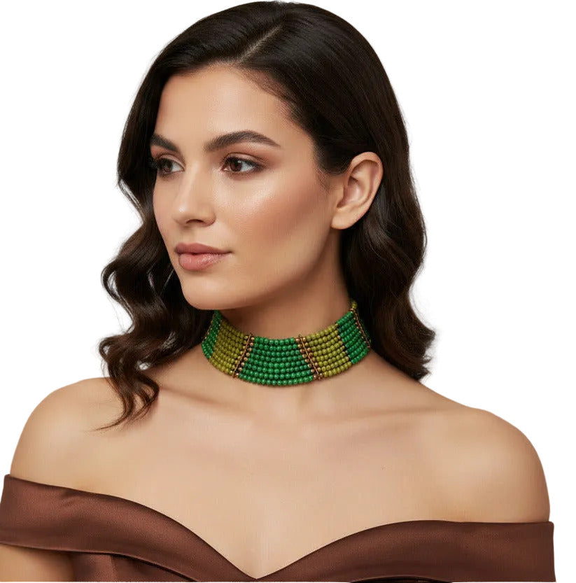 A multi-strand beaded statement necklace featuring shades of green and olive green beads accented with small gold spacer rings, displayed on a clean white background.