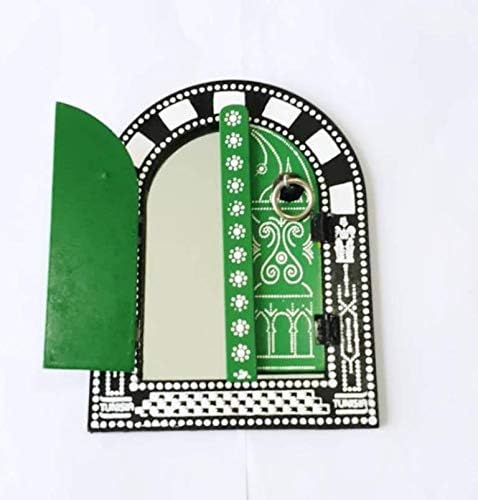 Decorative green door with black and white arch on a white background
