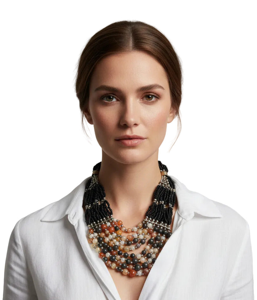 Woman wearing a lava rock stone Berber-style necklace with amber resin beads--TTP 