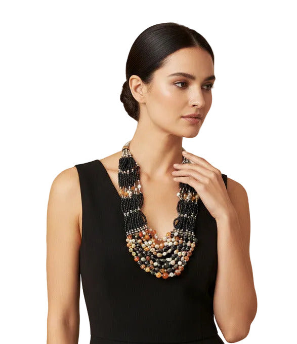  Woman wearing a lava rock stone Berber-style necklace with amber resin beads--TTP 