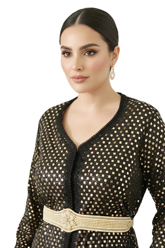 a woman wearing a handmade golden sparkly checkers caftan -TTP