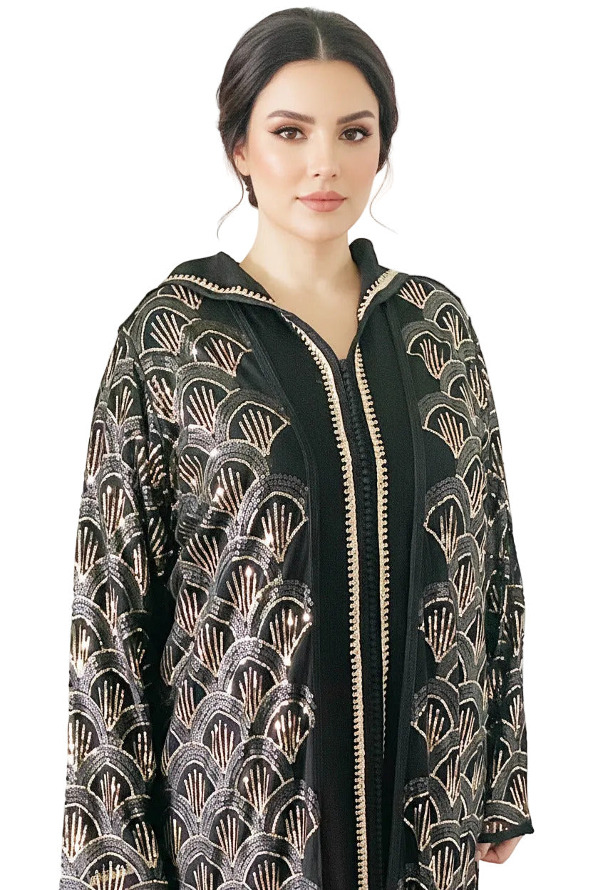 Woman wearing a black and gold patterned jacket on a white background