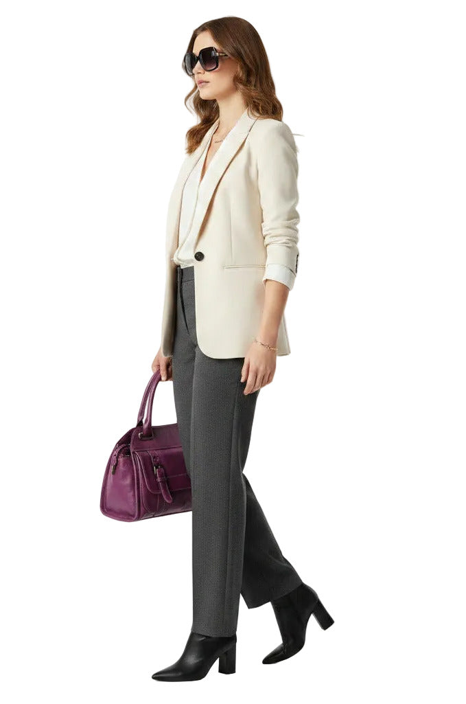 A purple leather handbag with dual top handles, two front buckle straps, and brass-tone hardware, shown against a plain white background.