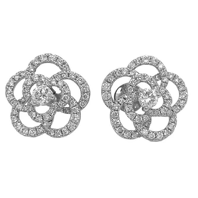 Pair of silver floral earrings on a white background