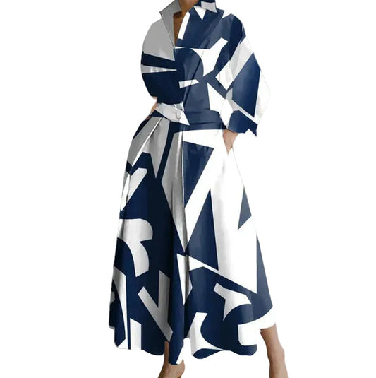 Woman wearing a blue and white patterned dress in an indoor setting