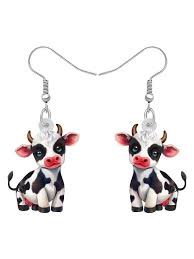 Cow-shaped earrings on a white background